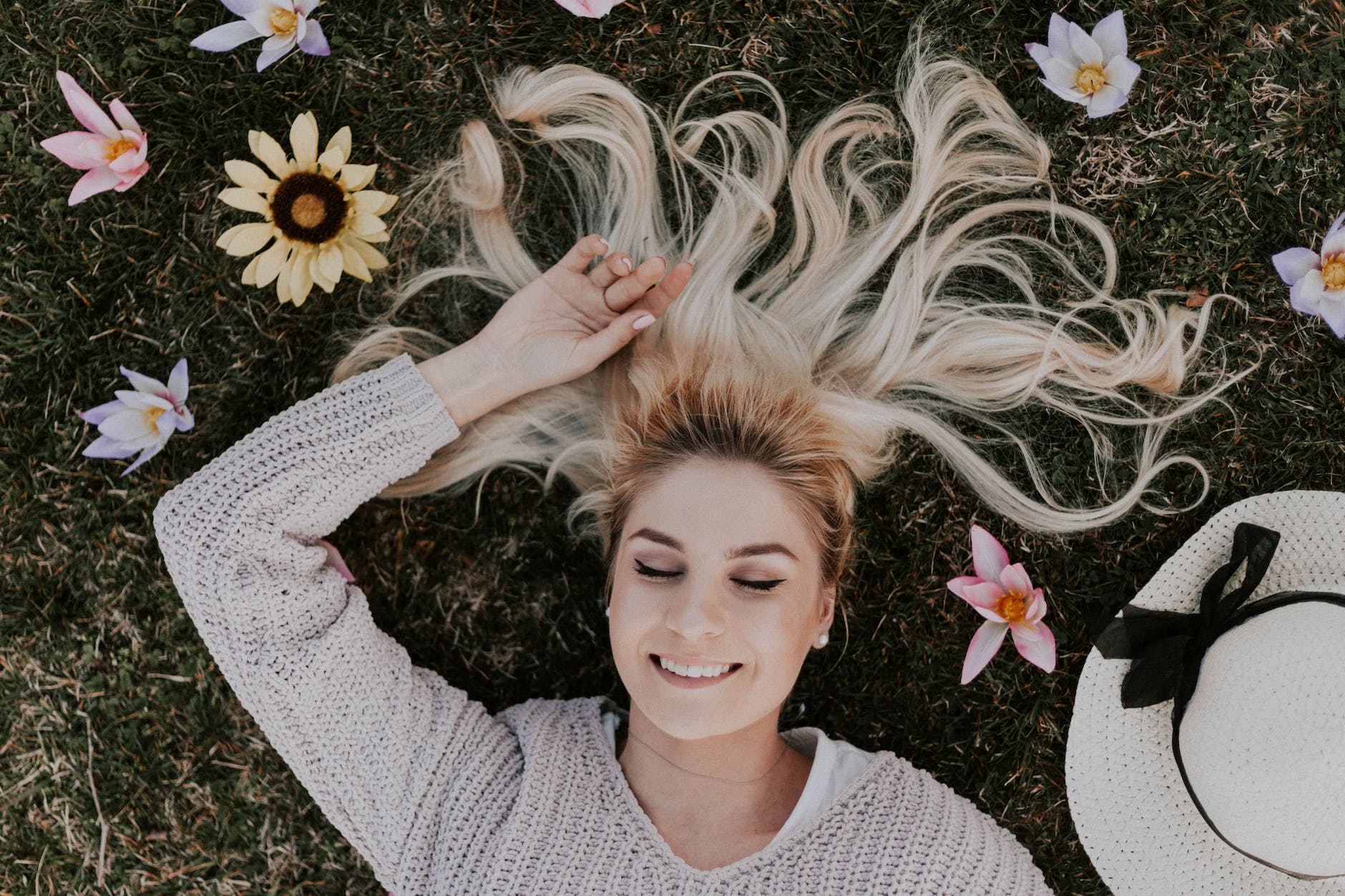 woman lying on flowers, 777 meaning manifestation