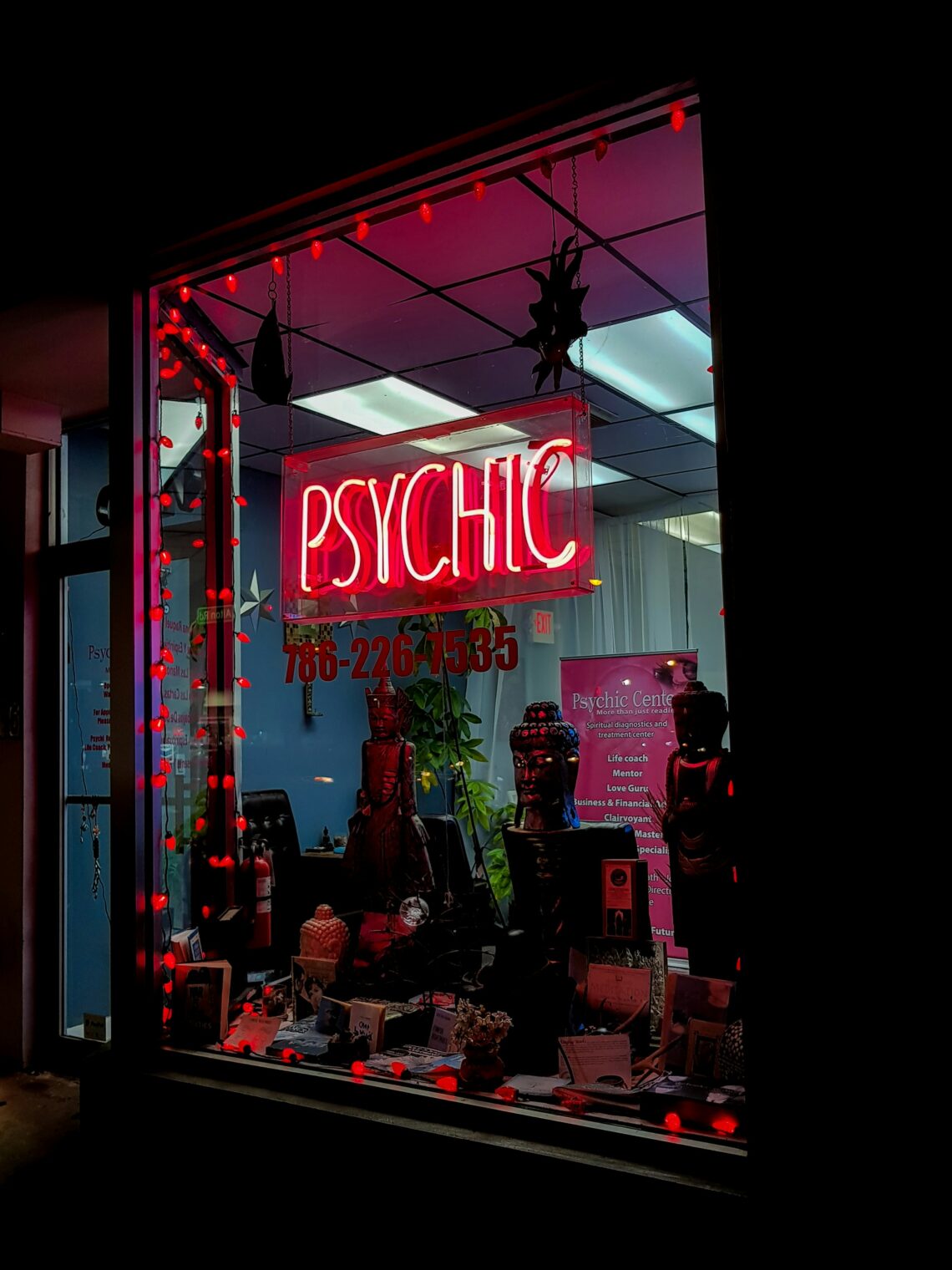 a neon psychic sign in a window